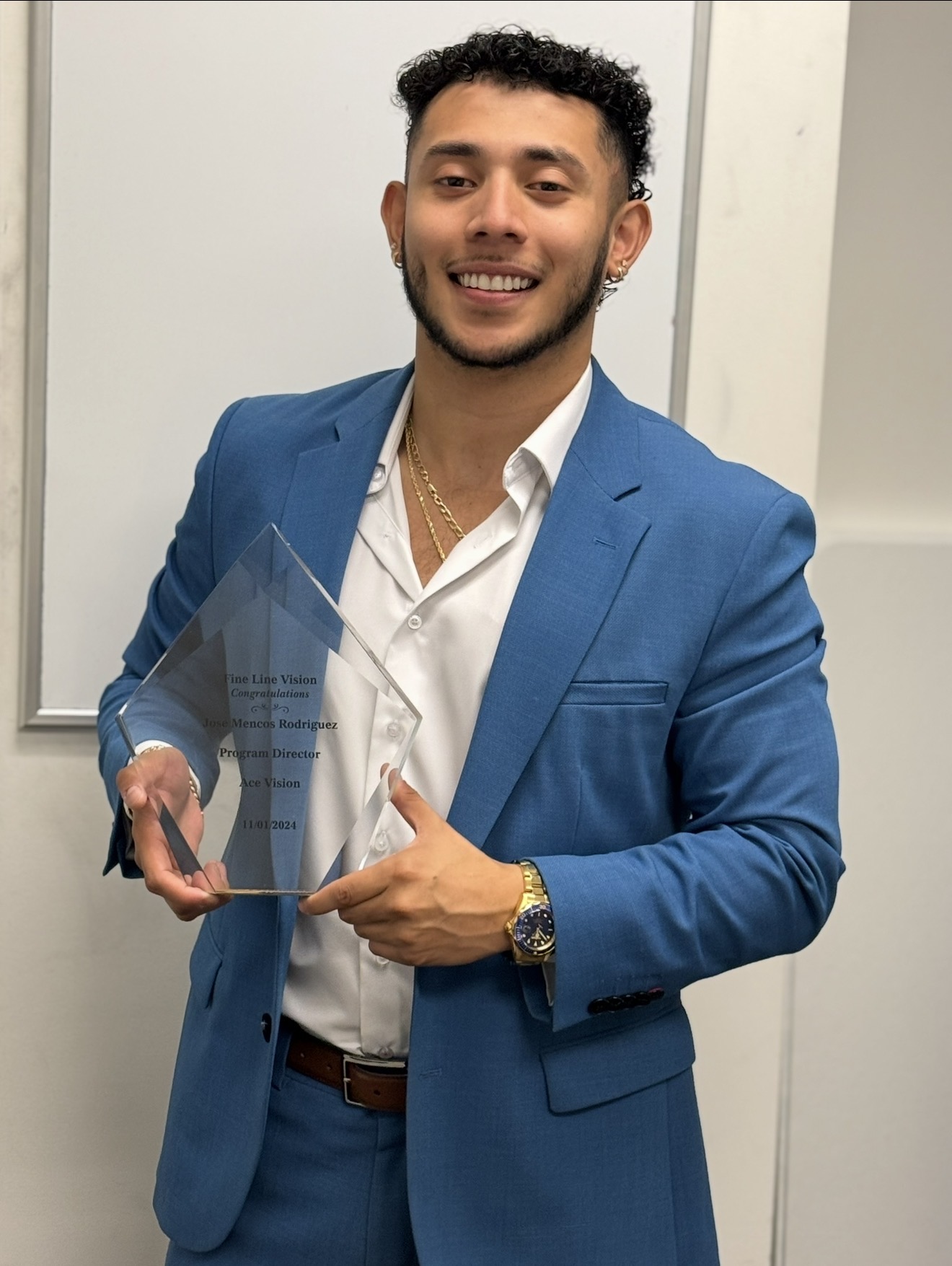 Fine Line Vision team member receiving Program Director award